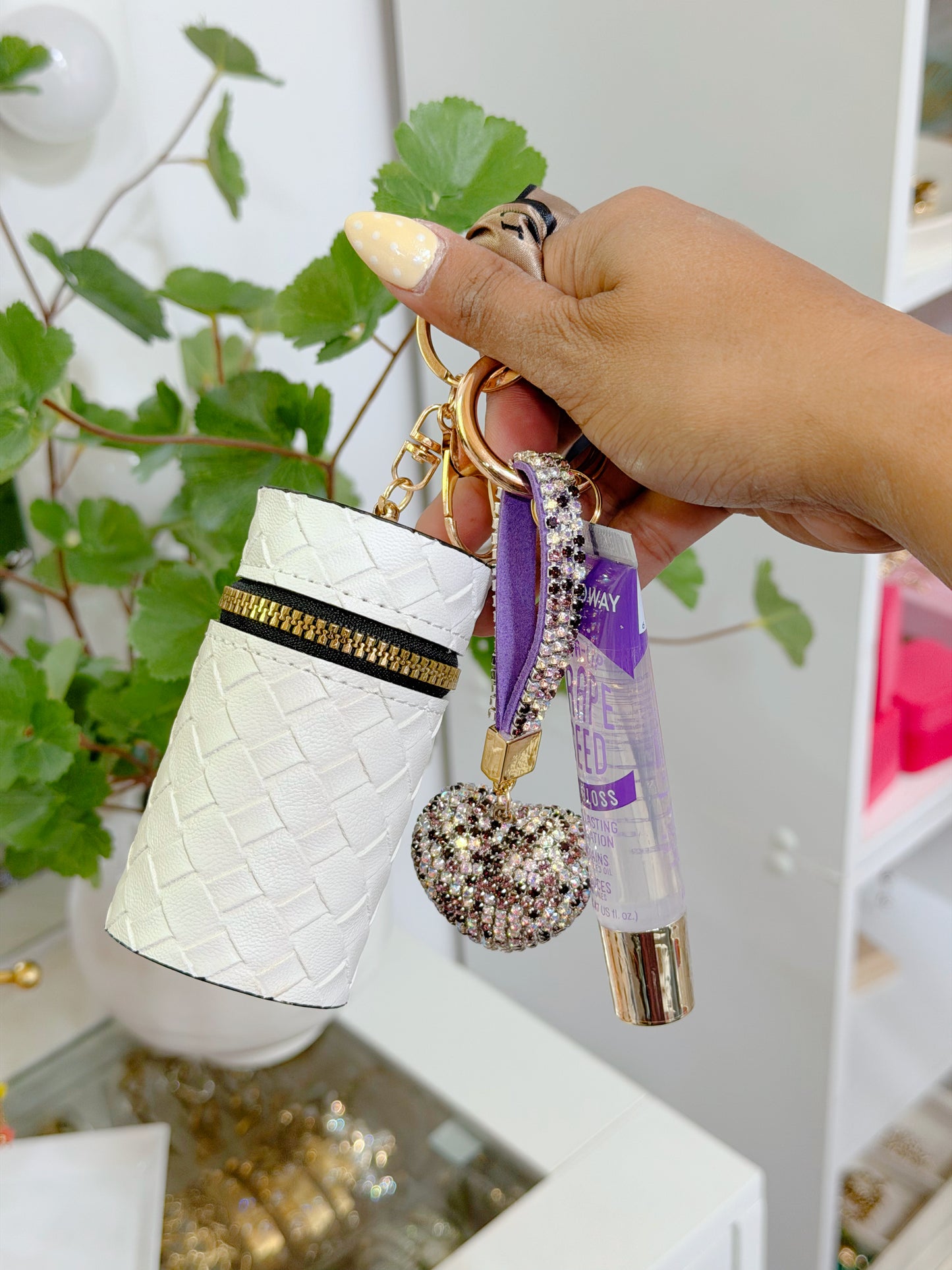 White woven coin purse combo set with gold zipper, black trim, purple rhinestone heart charm, and grape seed lip gloss on a key ring.