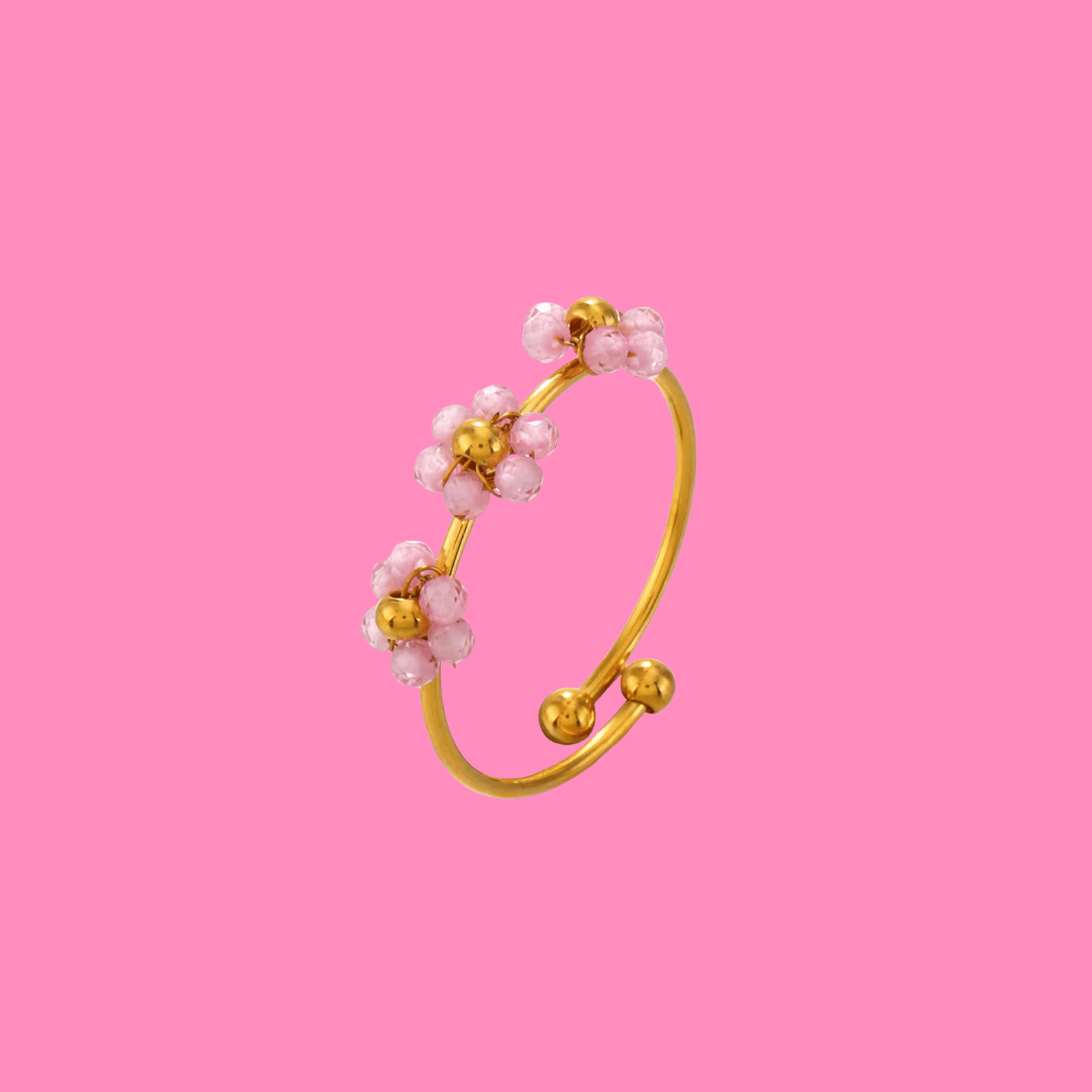 Gold ring with pink beaded flowers, adjustable.