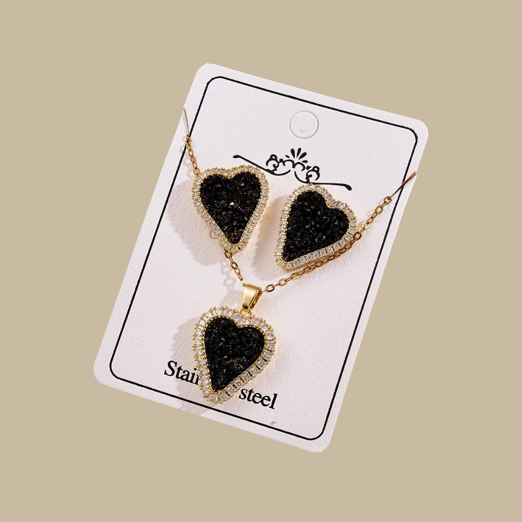 Crystal love sets by Stainless Steel with gold trim and black gemstone heart design.