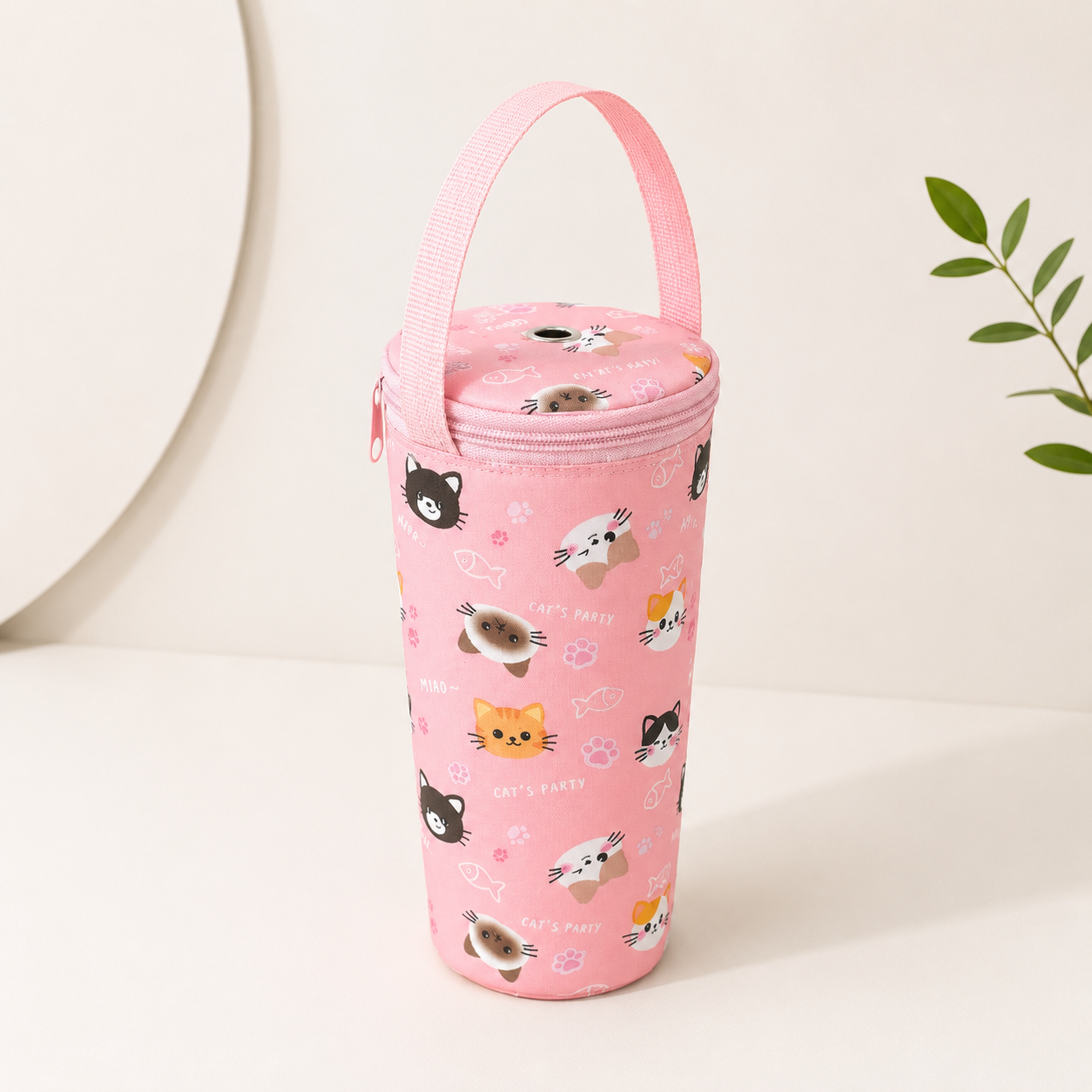 Pink insulated drink cup carrier bag with cute cat pattern, zipper top, and matching handle, shown front view on white surface.