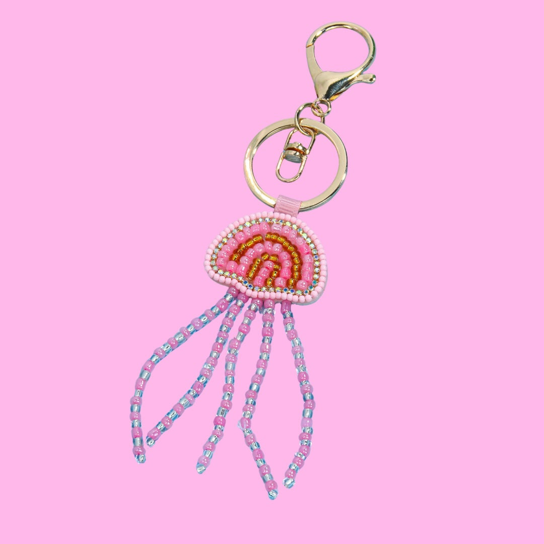 Pink Jelly Fish Beaded Bag Charm featuring a rainbow pattern on the head and long beaded tentacles, with a gold keyring and clasp.
