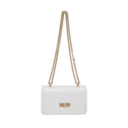 White shoulder bag by Bella with a gold chain strap and faux snakeskin texture.