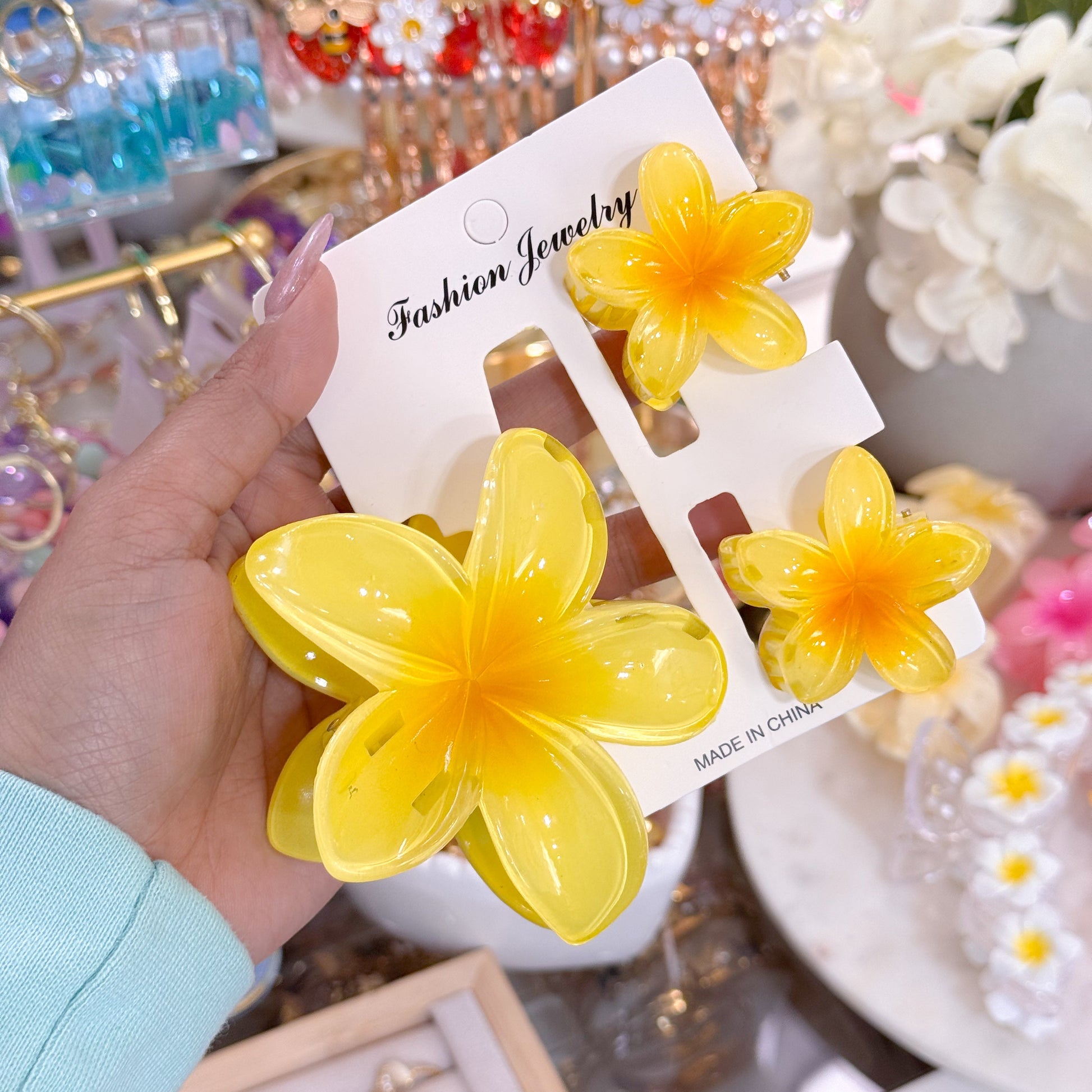 Yellow plumeria hair clip sets by Fashion Jewelry, featuring a glossy finish with a flower design.