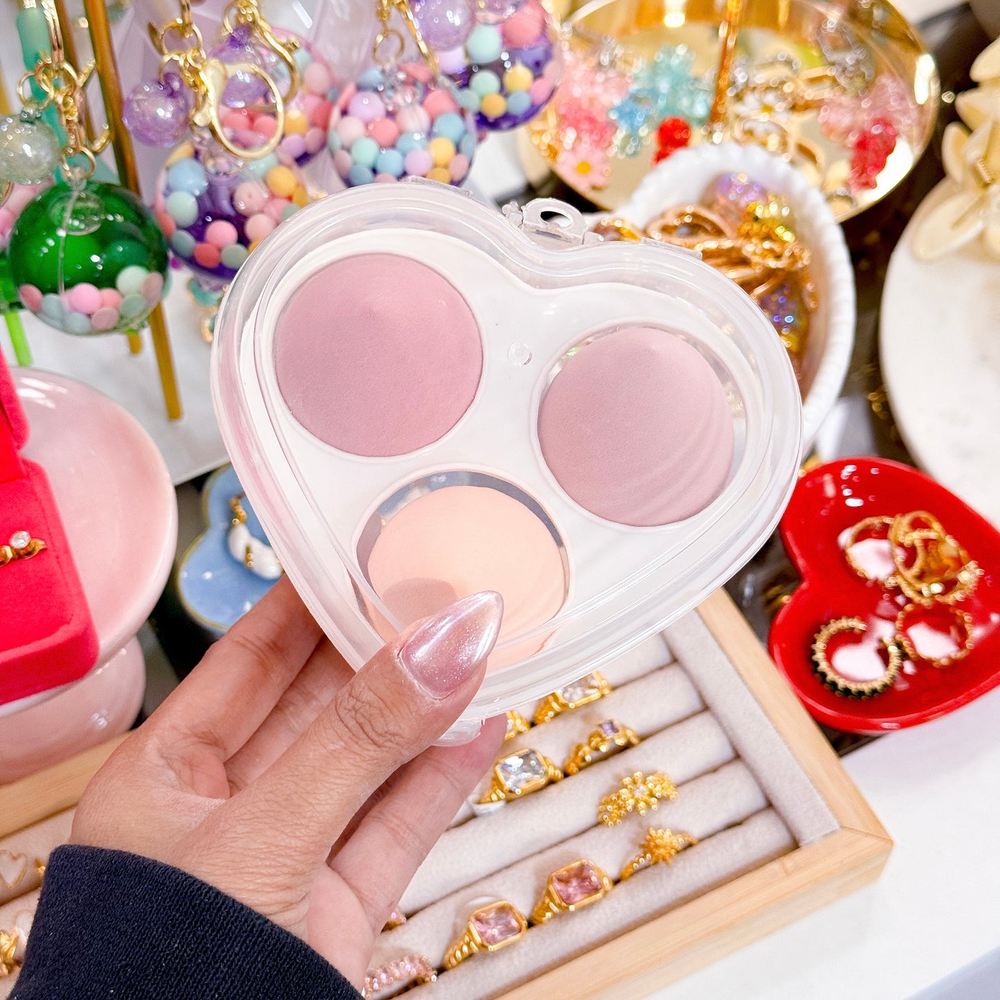 Heart-shaped makeup sponge set, by unknown brand, with a two-toned pink and peach palette.