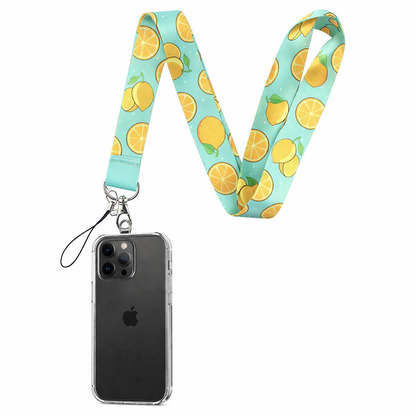 Phone lanyard with a teal blue background and a yellow lemon and orange pattern, attached to a clear phone case.
