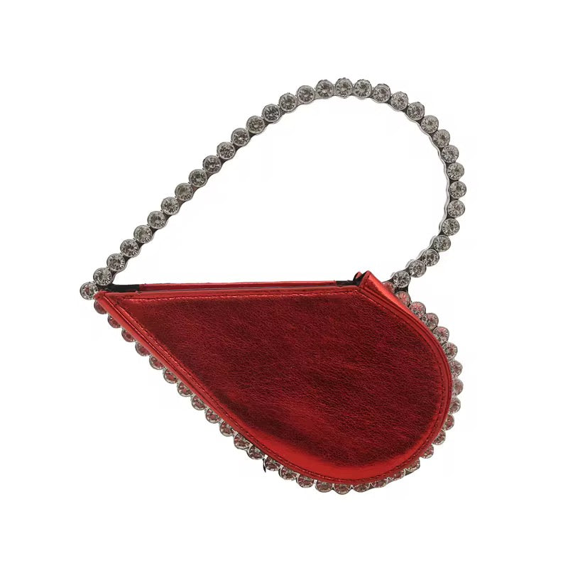 red evening handbag featuring rhinestone trim and a crystal top handle.