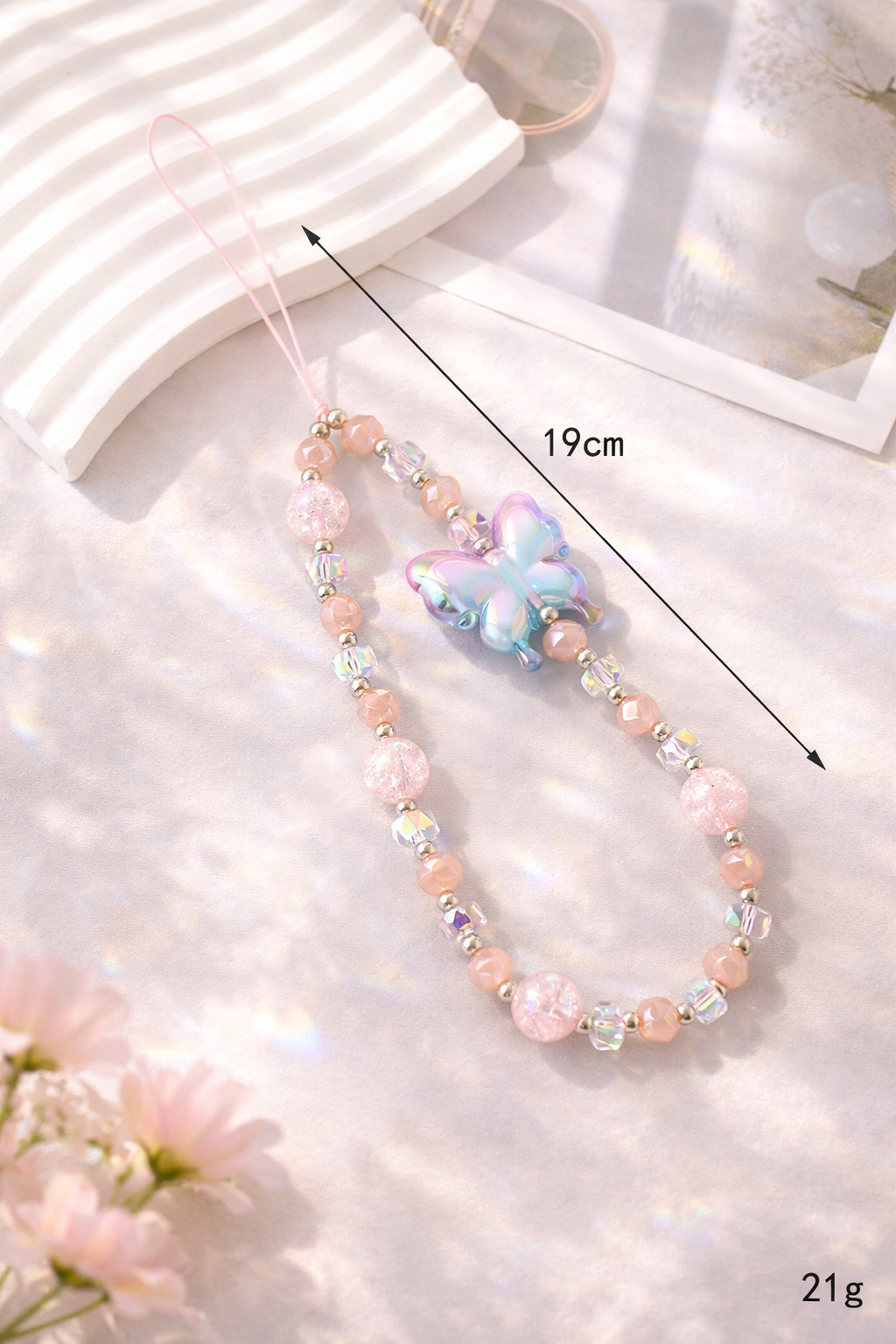 Holographic butterfly phone charm with pink and clear iridescent beaded strap, 19cm long, 21g weight.