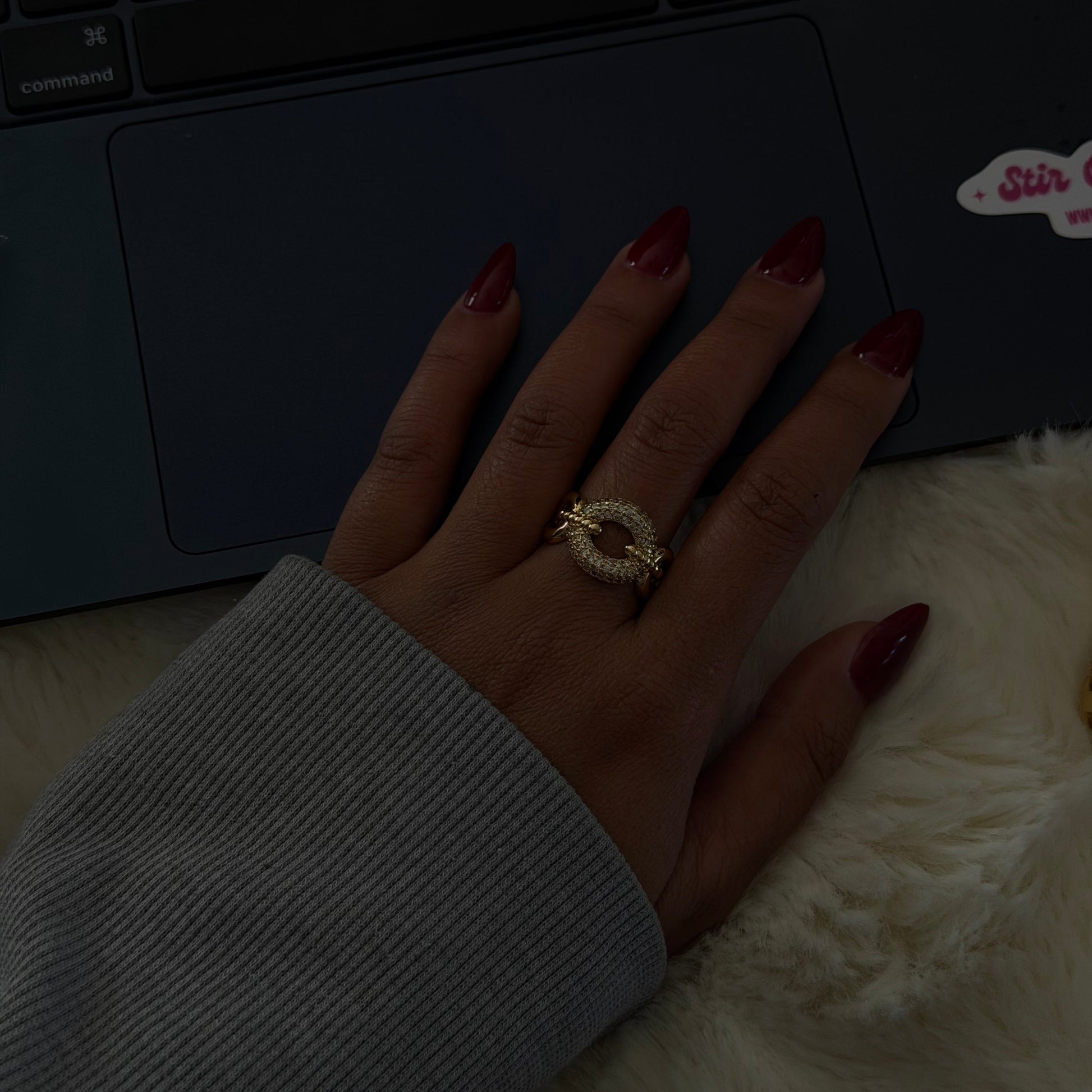 Gold adjustable statement ring featuring a pavé-set circular design