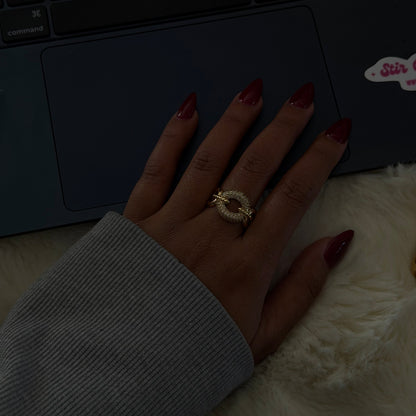 Gold adjustable statement ring featuring a pavé-set circular design