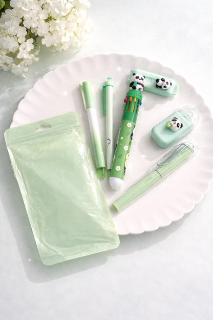 Light green desk set featuring panda-themed pens, correction tape, highlighter, and a pouch, neatly arranged on a white plate.