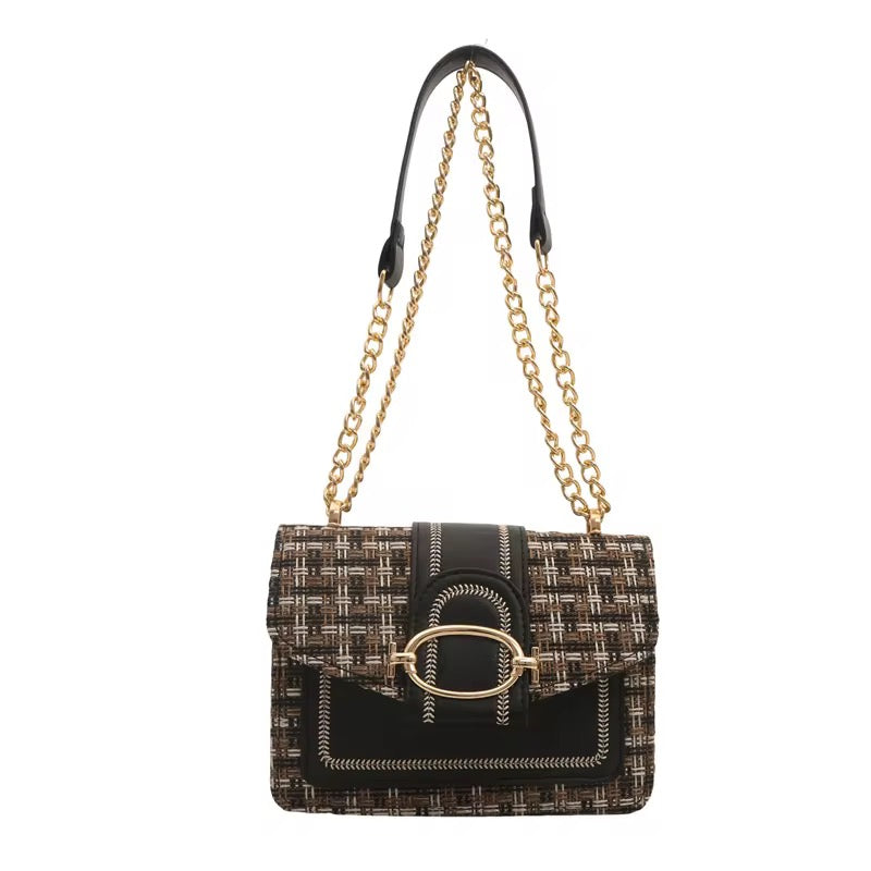 Tweed chain purse with black leather accents, a gold clasp, and gold chain straps.