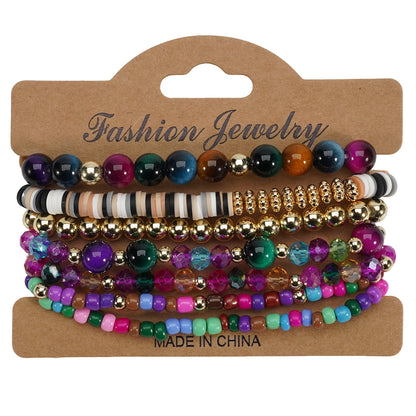 Bohemian style layered bracelets featuring various colorful beads, gold-toned accents, and a brown display card.