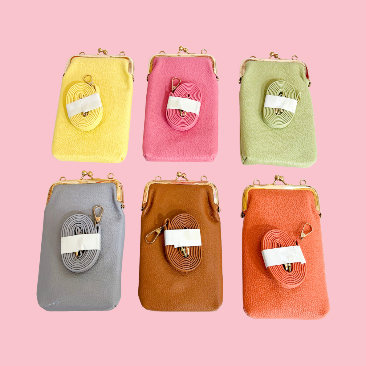 Six slim phone crossbody bags displayed on a pink background in yellow, pink, light green, gray, brown, and orange, each with a gold clasp frame and a matching detachable strap placed on the front.