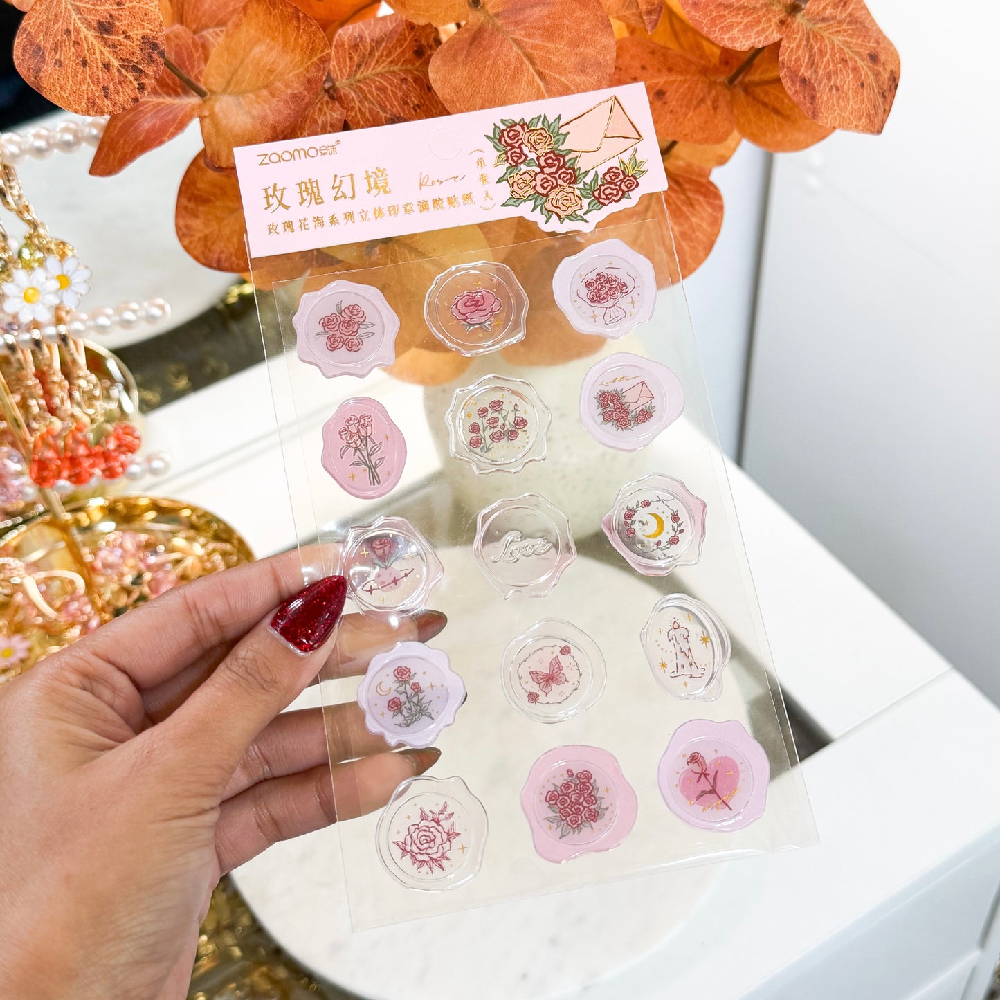 Wax seal stickers by Zaomo, featuring rose, butterfly, and love-themed designs in a variety of pale pink and transparent colors.
