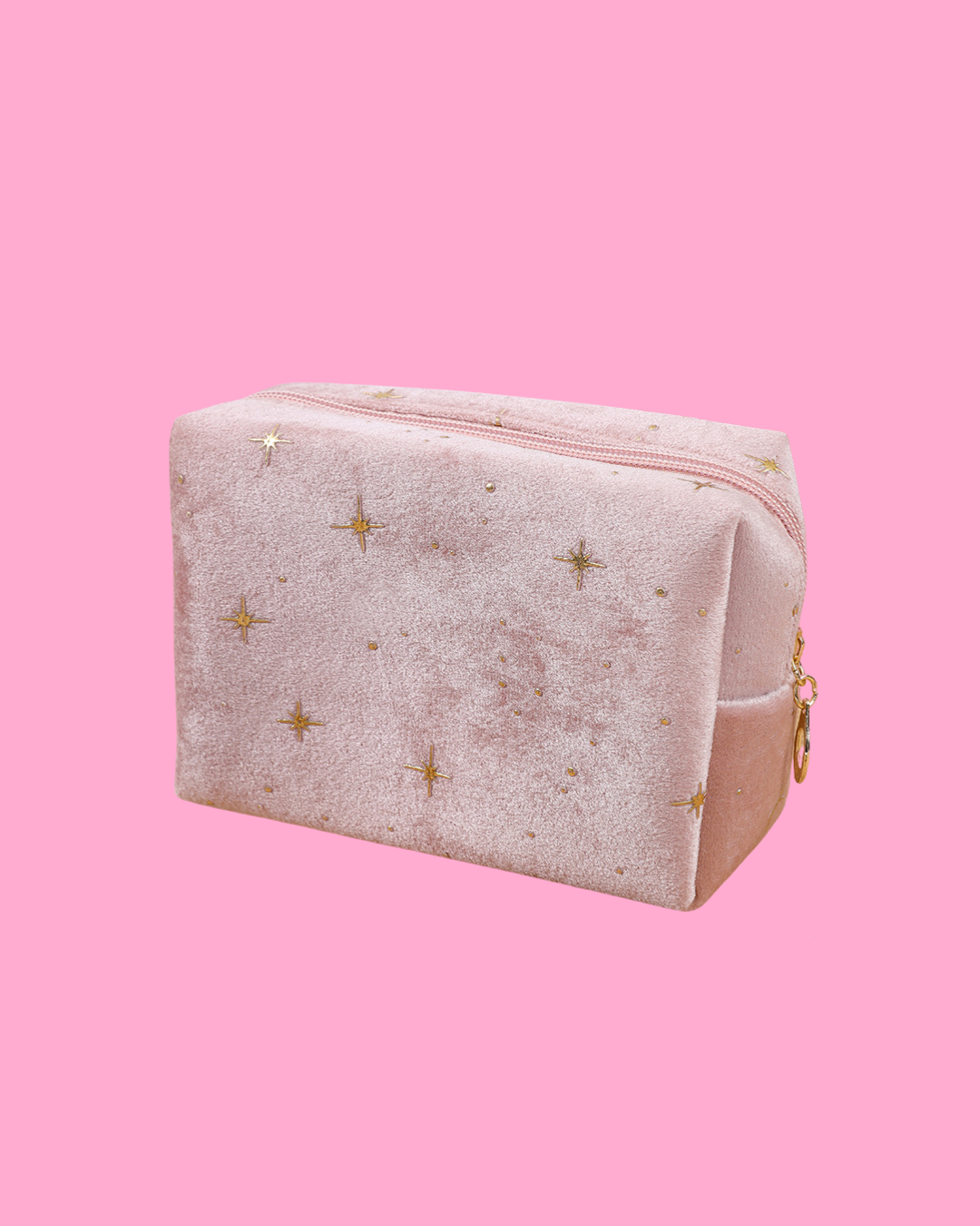 Pink velvet cosmic pouch with gold embroidered stars and scattered gold dots.