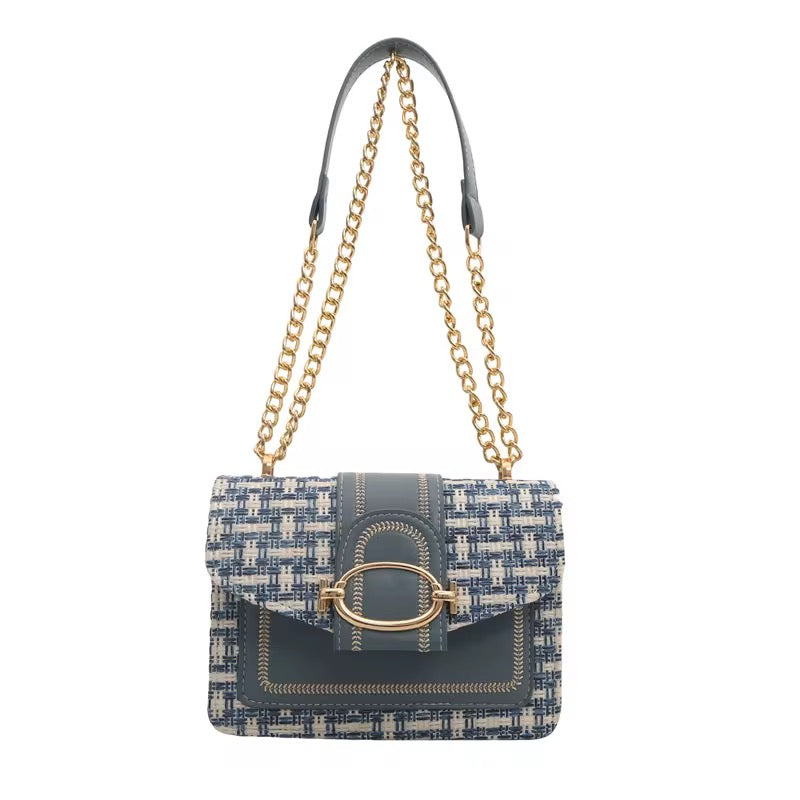 Blue and white tweed purse with a chain strap, featuring gold accents.