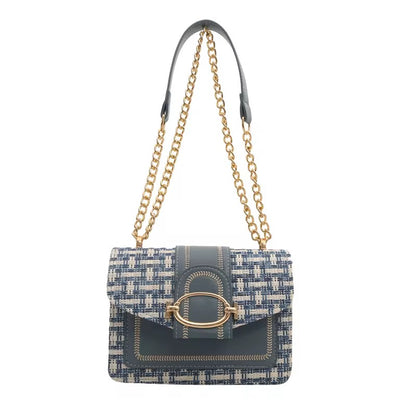 Blue and white tweed purse with a chain strap, featuring gold accents.