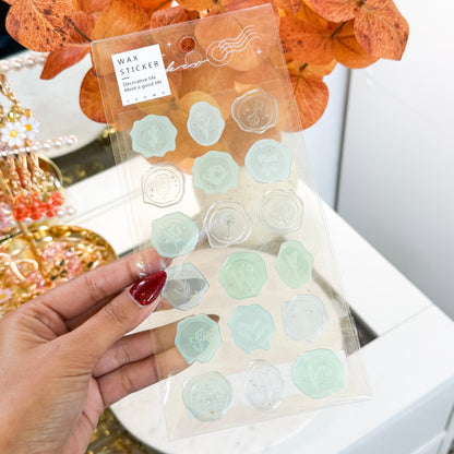 Wax seal stickers by ZAOMO, featuring delicate floral and botanical designs in muted green and clear shades.