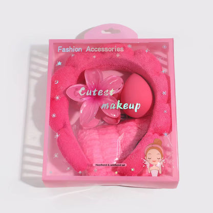 Pink makeup set with headband and sponge in packaging labeled 'Fashion Accessories' and 'Cutest makeup'.