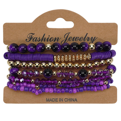 Bohemian layered bracelets featuring various purple and gold beads, including smooth, faceted, and disc shapes, presented on a brown display card.