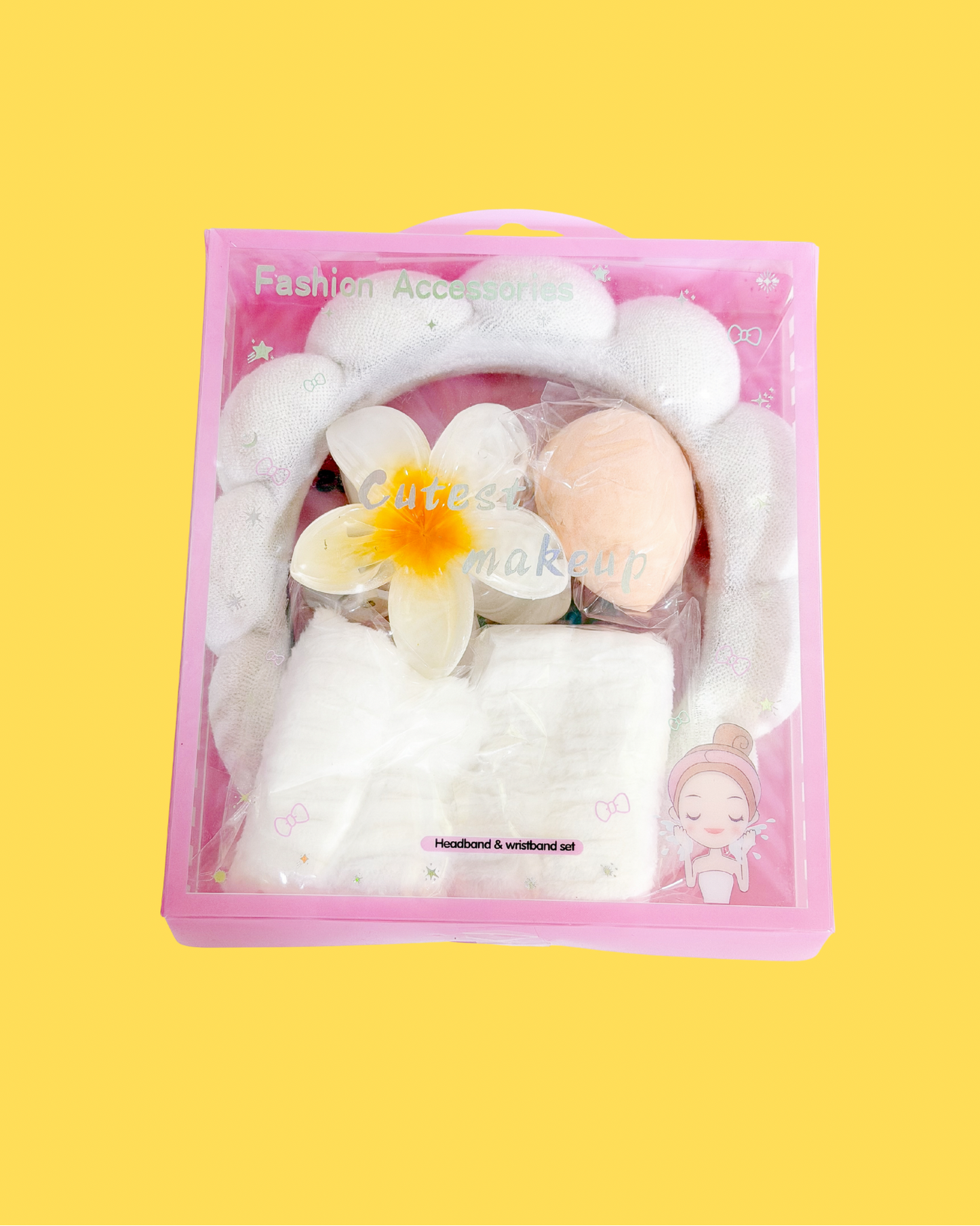 Sweetheart Spa Set in a clear pink box, featuring a white fluffy star-embellished headband, matching wristbands, a peach makeup sponge, and a white flower.