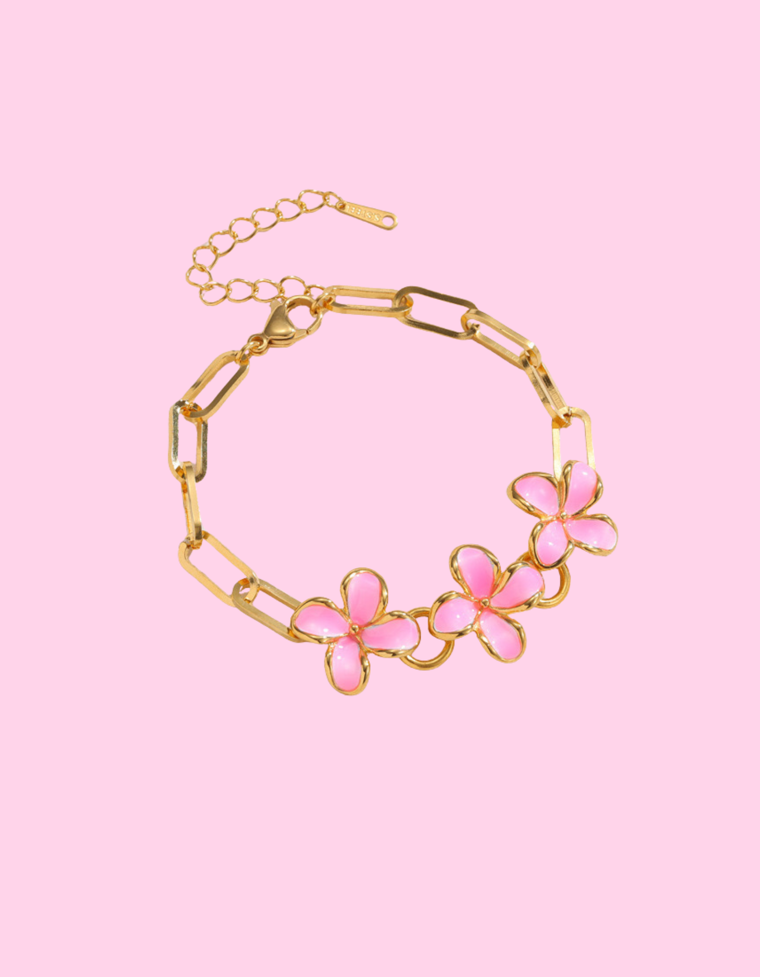 Gold-toned stainless steel paperclip chain bracelet with three pink enamel camellia flower charms.