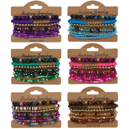 Six sets of bohemian layered bracelets in various colors, featuring mixed beads and gold-tone accents.