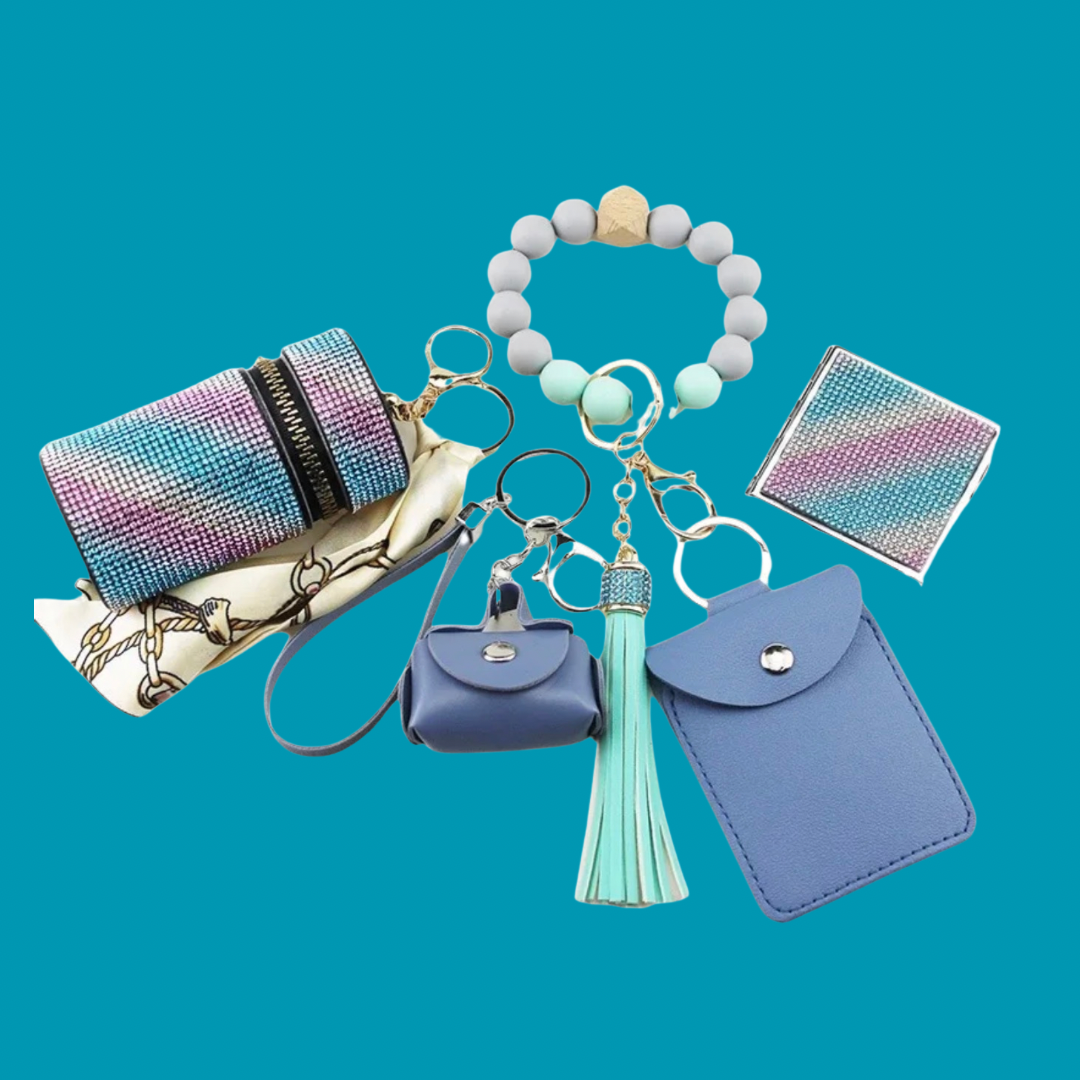 Multi color purple , blue, silver  Luxe keychain wristlet accessory set featuring a beaded wristlet, rhinestone zip pouch, mini pouch, tassel charm, card holder, and sparkly compact mirror in coordinating colors.