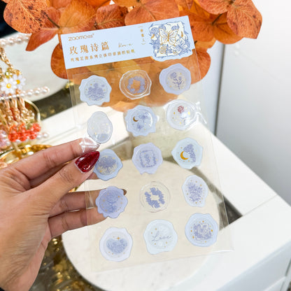 Wax seal stickers by Zaomo with rose and butterfly patterns in light blue and gold.
