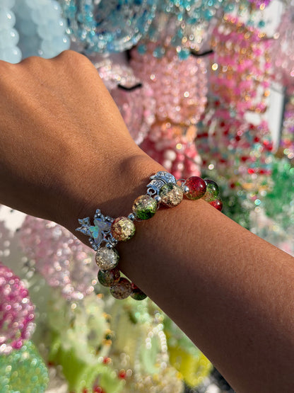 Butterfly Green Lucky Charm Beaded Bracelet with multi-colored glitter crackle beads, silver butterfly, and lucky charm on a wrist.