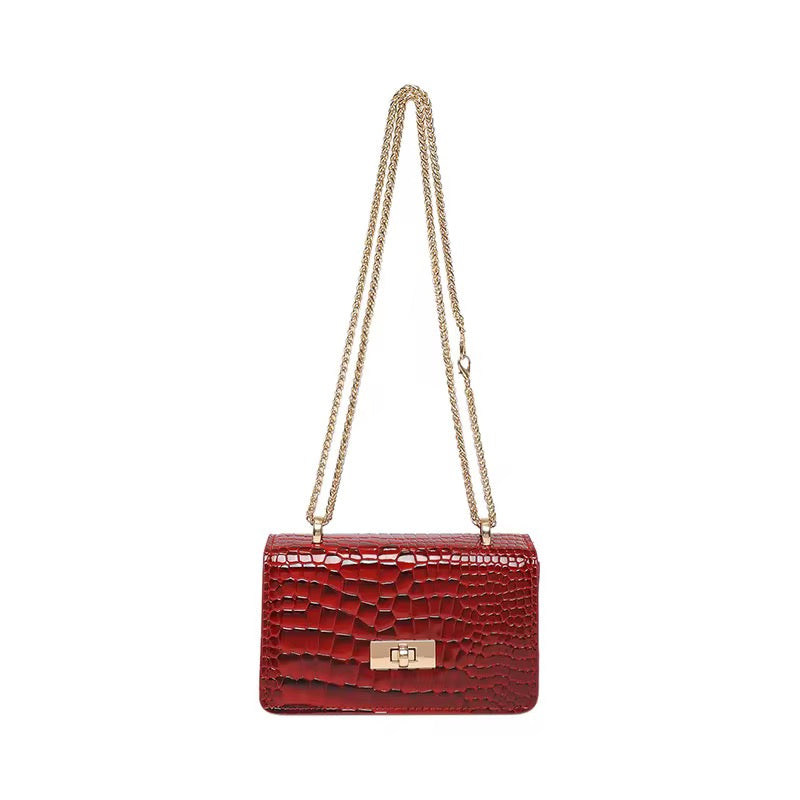 Red Bella flap shoulder bag with a gold chain.
