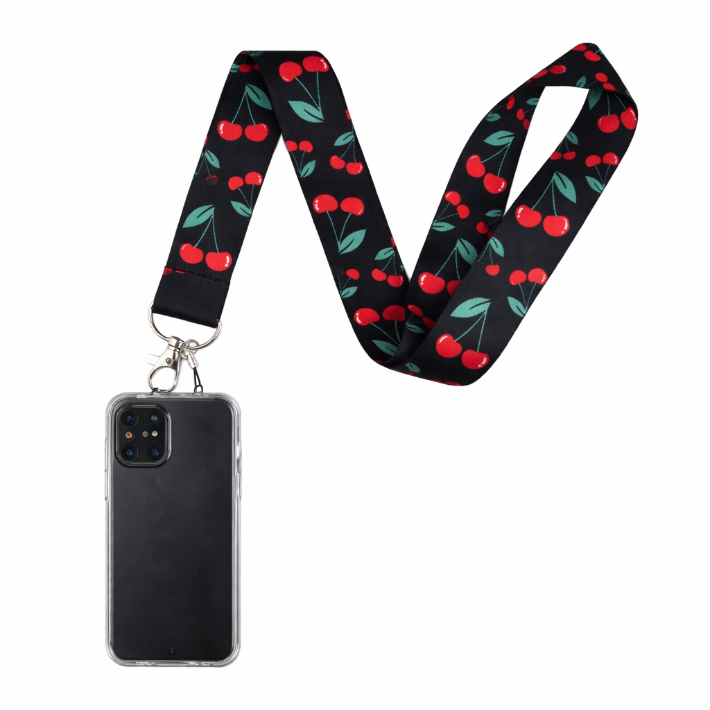 Black Summer Phone Lanyard with red cherry and green leaf pattern, attached to a clear phone case holding a black smartphone.