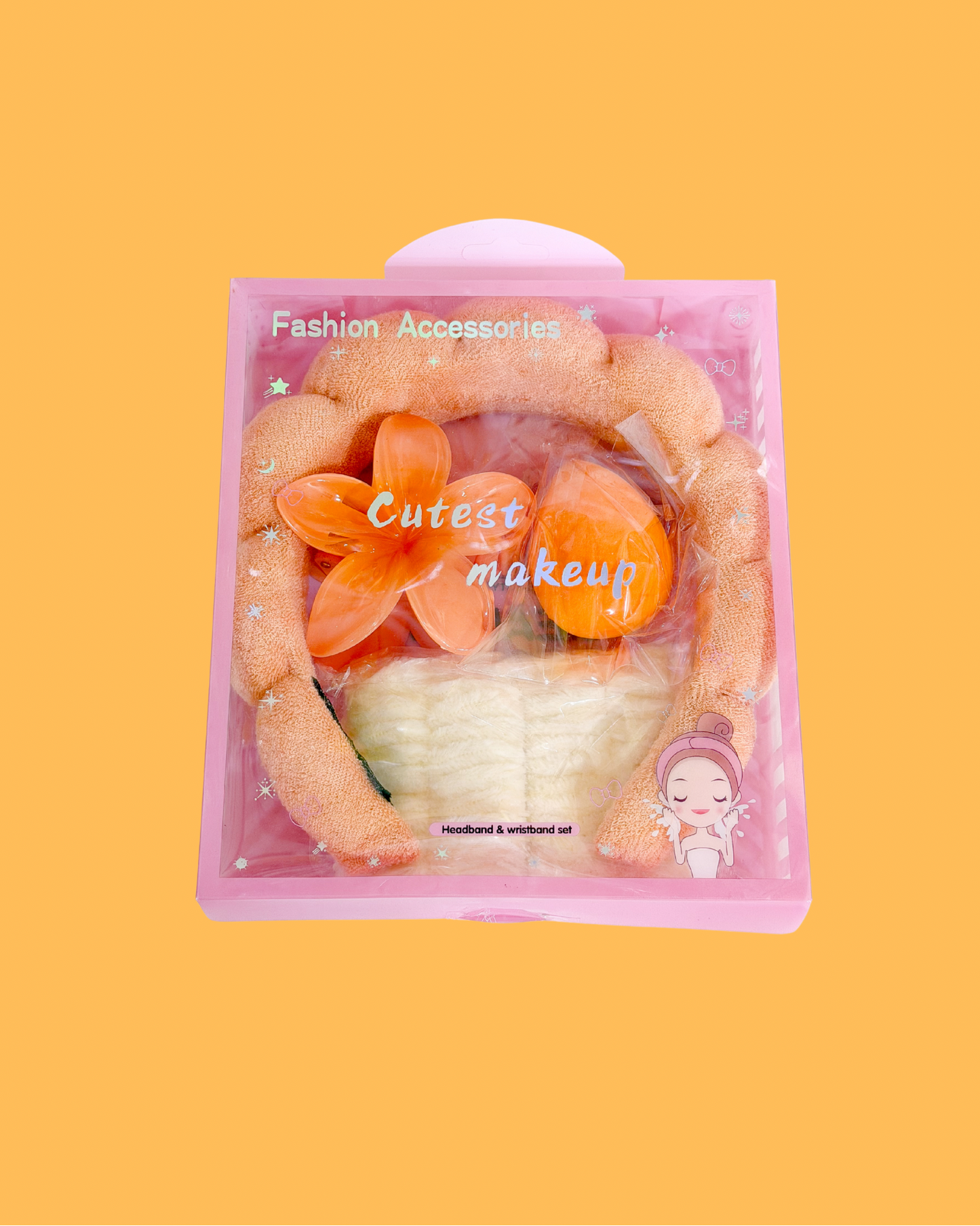 Sweetheart Spa Set packaged in a clear pink box, containing an orange fluffy headband, white wristbands, and orange makeup sponges.