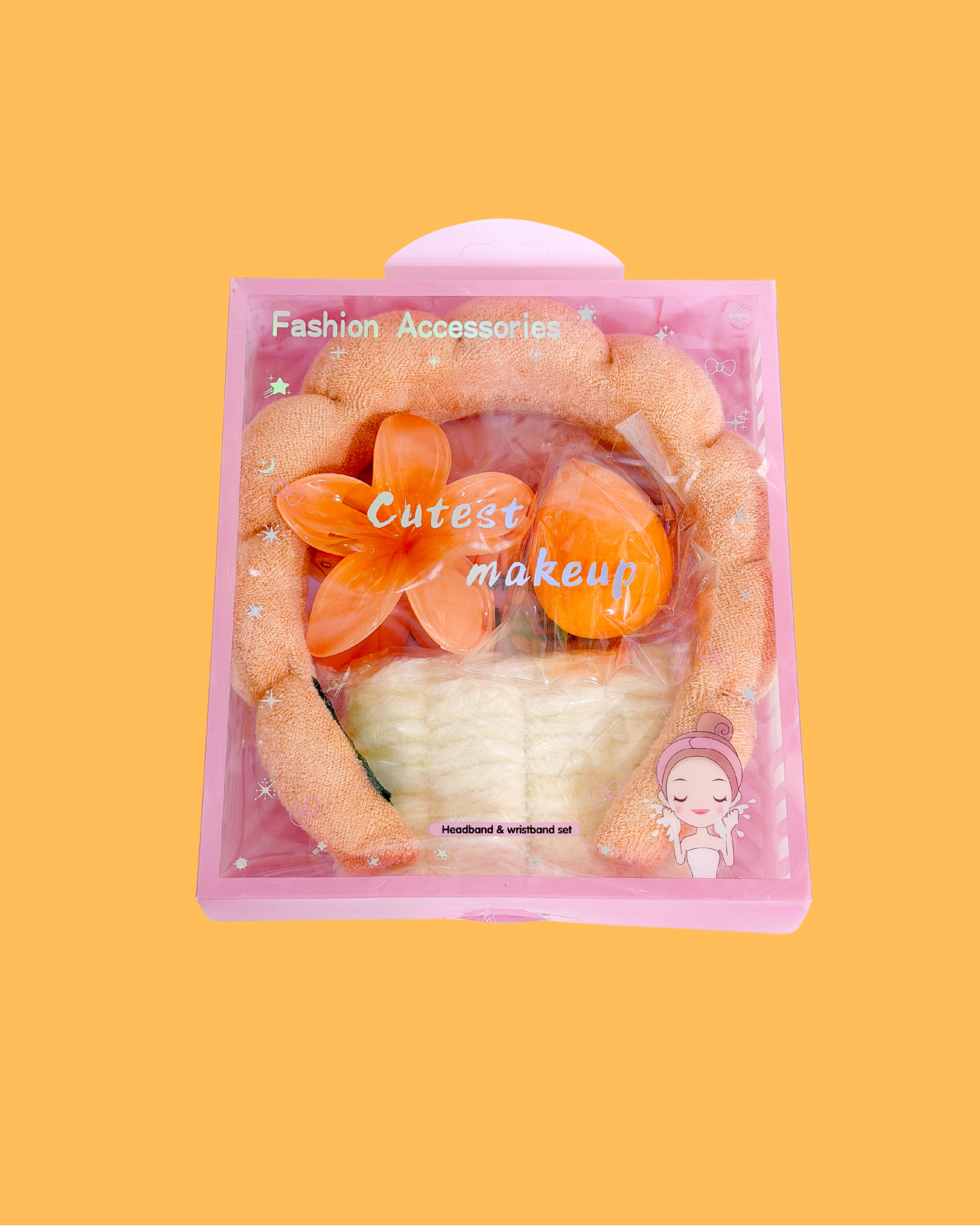 Sweetheart Spa Set packaged in a clear pink box, containing an orange fluffy headband, white wristbands, and orange makeup sponges.