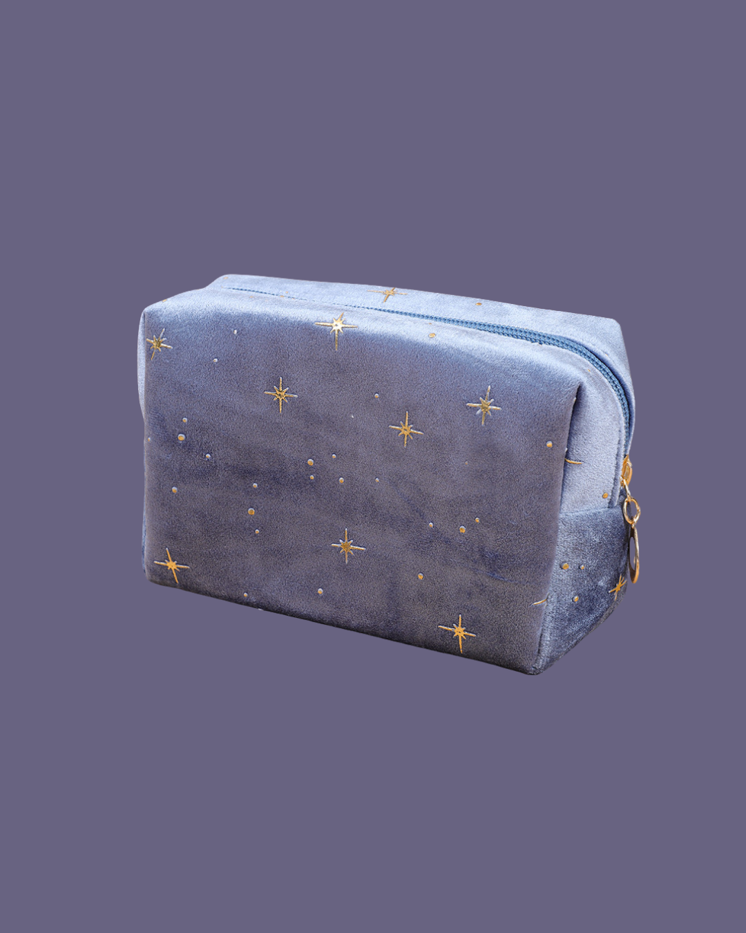 Blue velvet cosmic pouch with gold embroidered stars and dots, and a zipper.