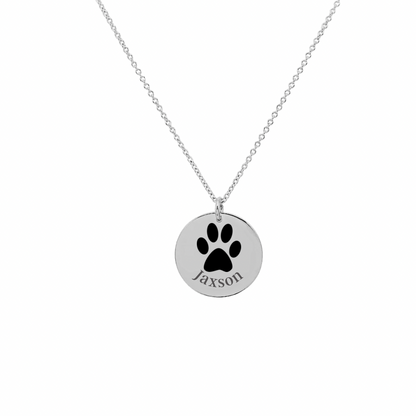 Silver necklace with paw print pendant by Custom Paw Prints, engraved with the name "Jaxson".